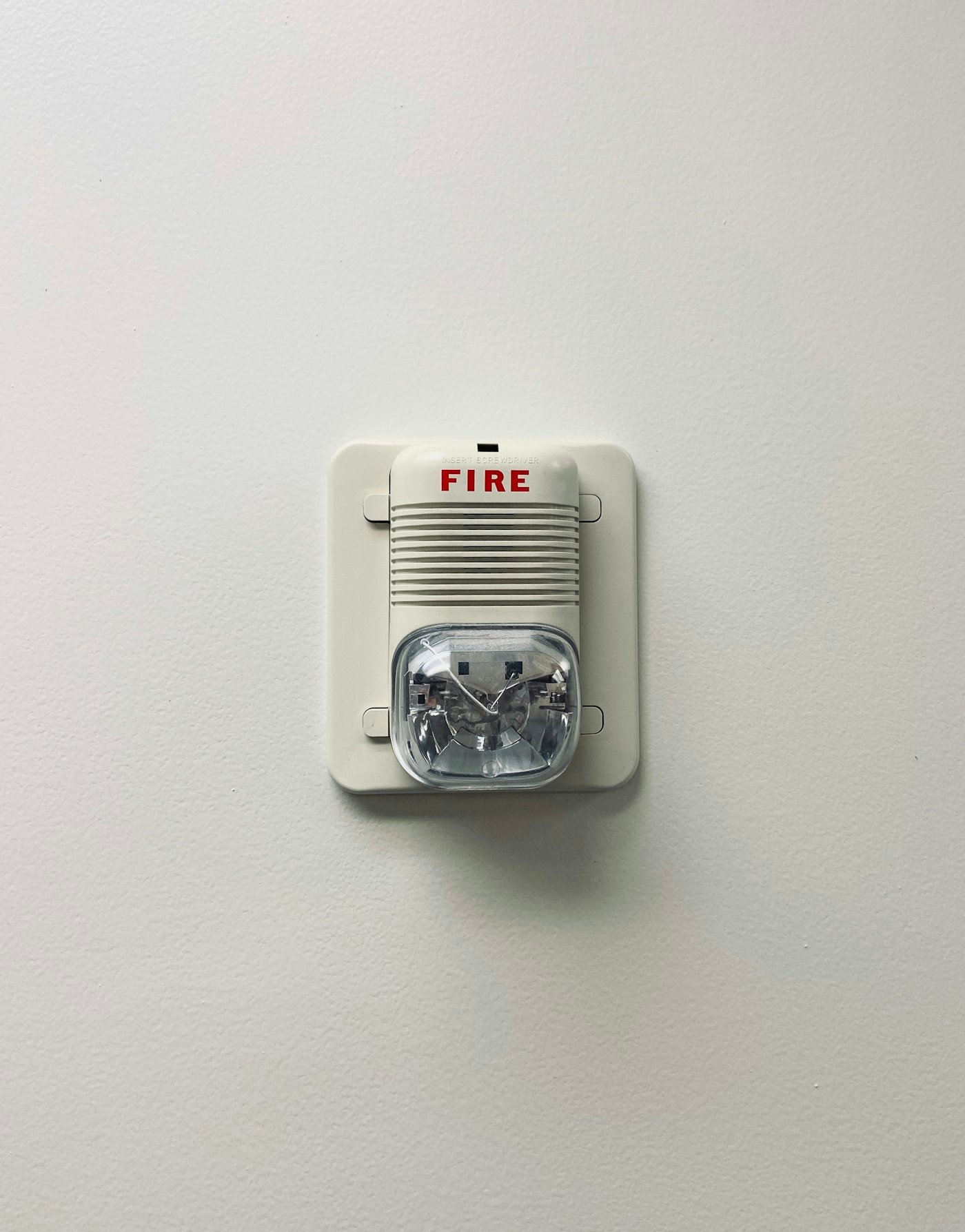 Wall-mounted alarm device